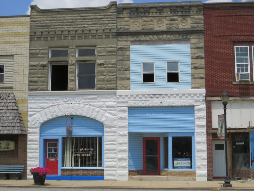 A row of buildings sitting on the side of a street