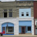 A row of buildings sitting on the side of a street