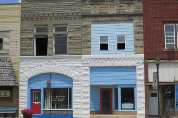 A row of buildings sitting on the side of a street