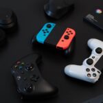 white and orange game controller