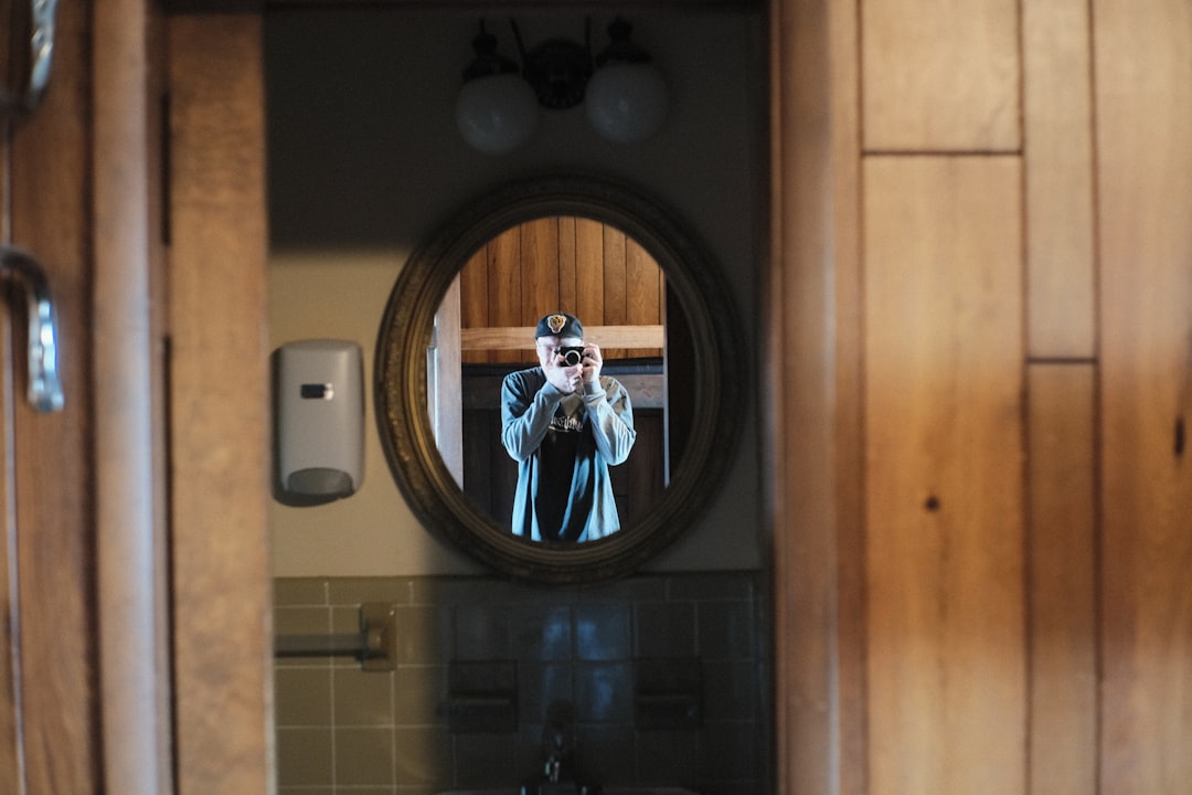 a man taking a picture of himself in a mirror