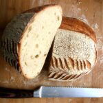 sliced bread on brown wooden chopping board
