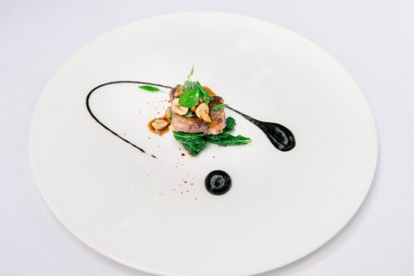 green vegetable on white ceramic plate