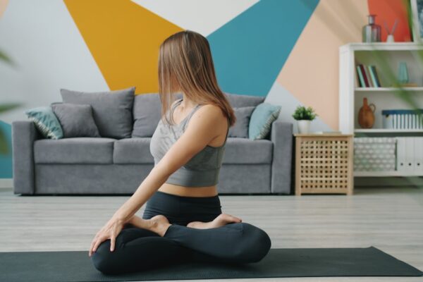 Woman doing a yoga twist on a mat