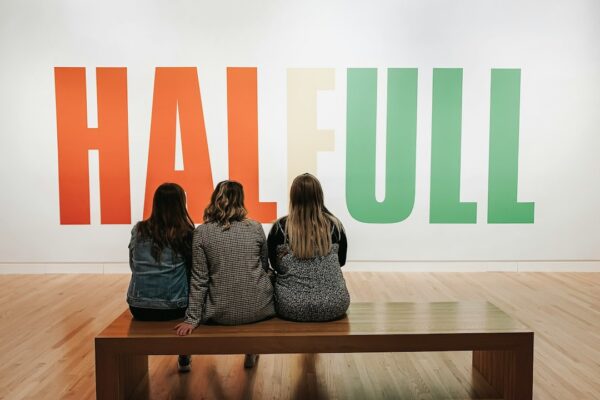 women sitting on bench