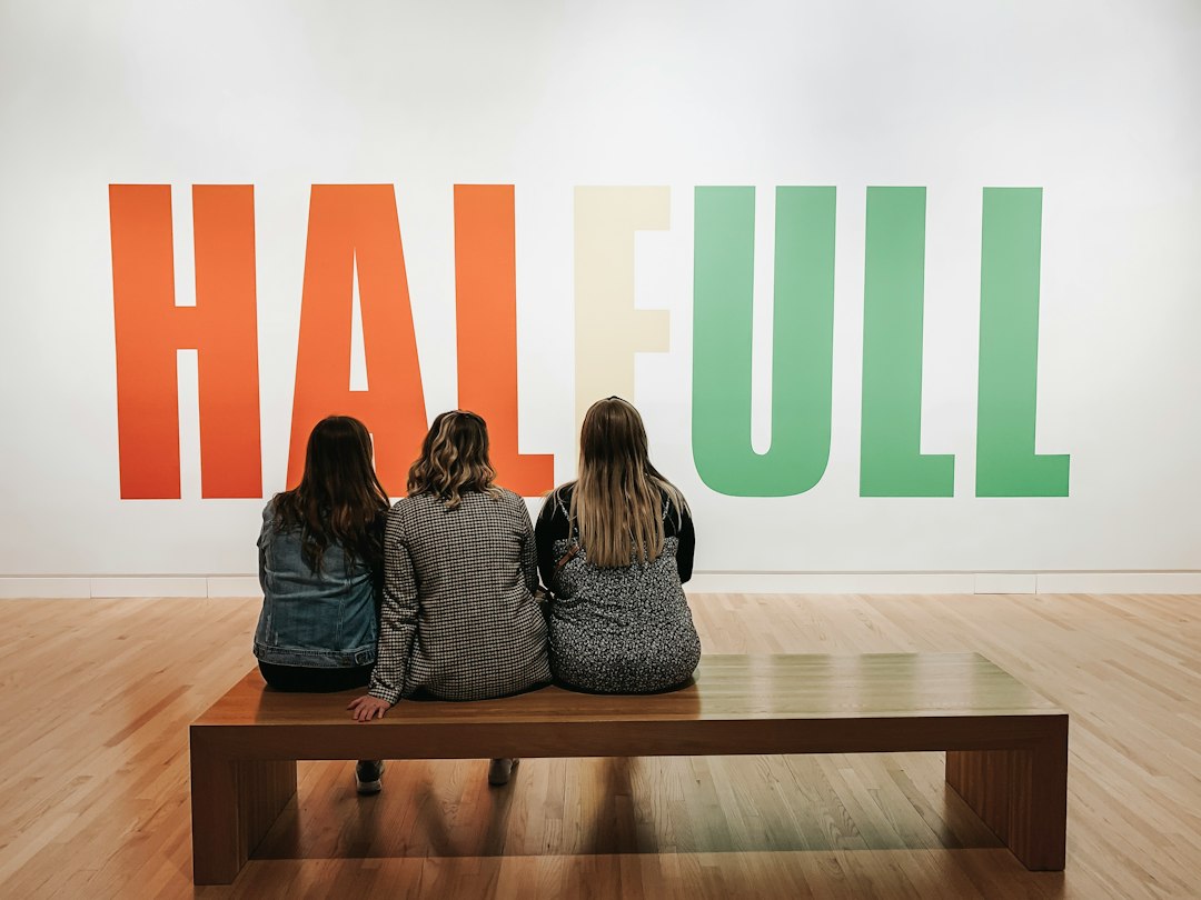 women sitting on bench
