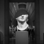 grayscale photo of woman statue
